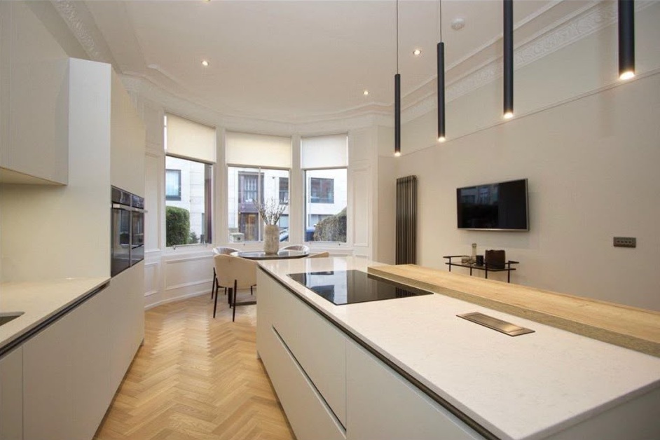 Re-skimmed kitchen walls and bay ceiling with a flawless matt finish in a Glasgow tenement